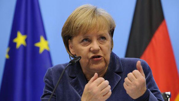Merkel, huiduită de manifestanţi la sosirea într-un centru de refugiaţi